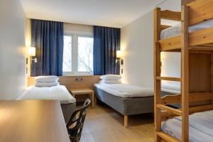 Postel nebo postele na pokoji v ubytování Göteborgs Mini-Hotel