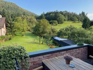 a view of a garden from the balcony of a house at Pine Cone Loft on Baden-Baden's Panorama Trail in Baden-Baden