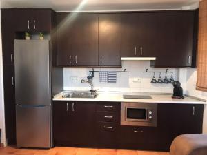 Kuchyňa alebo kuchynka v ubytovaní Isleta apartamento con terraza, vistas y WIFI