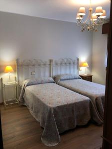 En eller flere senge i et værelse på Vivienda vacacional De La Prida