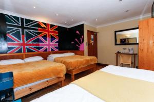 Postel nebo postele na pokoji v ubytování KX Rooms Kings Cross