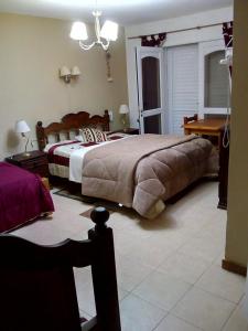 Tempat tidur dalam kamar di La Casona de Susana