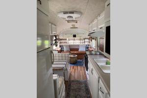 a kitchen and living room of an rv at Amazing Airstream, Beaufort, SC-Enjoy the Journey in Beaufort