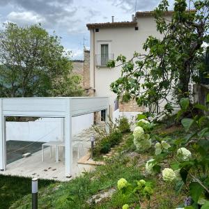 a house with a glass door and a patio at Casa Fisolare in Capestrano