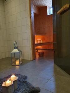 a room with candles on the floor of a room at Villa Vasa Sälen Nedre lägenhet in Transtrand