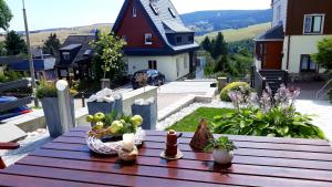 a table with fruits and candles on top of a house at Apartments - Lehmanns Ferienwohnungen in Kurort Oberwiesenthal