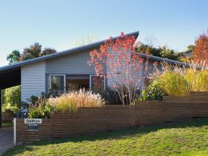 a house with a retaining fence in front of it at Delfryn in Daylesford