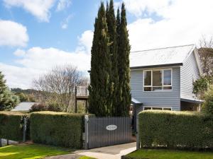 a house with a large tree in the yard at Accolade in Daylesford