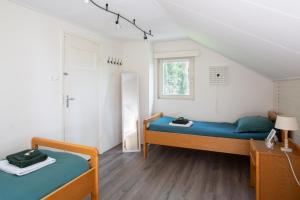 Säng eller sängar i ett rum på Koepel Enschede