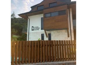 a house with a wooden fence in front of it at Casa Luxury Hotel in Göcek