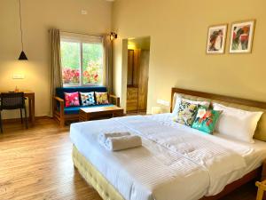 Flower Valley Plantation Homestay客房内的一张或多张床位