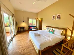 Flower Valley Plantation Homestay客房内的一张或多张床位