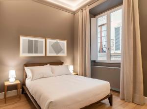 Łóżko lub łóżka w pokoju w obiekcie BSJ15-Borgo San Jacopo Room