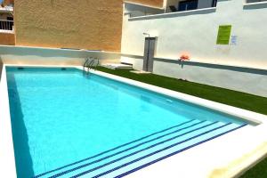 a swimming pool in the backyard of a house at Casa Puerto Isla Plana in Isla Plana