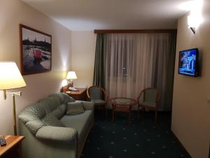 TV a/nebo společenská místnost v ubytování Palast Wellness Appartement