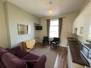 A seating area at 45 The Square Holiday Apartments 