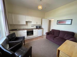 A seating area at 45 The Square Holiday Apartments 