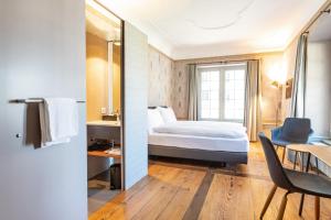 En eller flere senger på et rom på Resort Schloss Rued