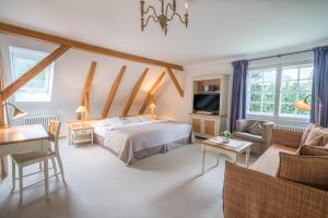 TV a/nebo společenská místnost v ubytování Geldernhaus Hotel garni