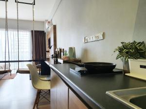 a kitchen with a counter with a bowl on a counter top at Aeropod Sovo Kota Kinabalu By LAXZONE in Kota Kinabalu