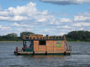 a house boat floating on the water at Wunderschöne Ferienwohnung in Brandenburg an der Havel