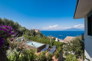a view of the ocean from a house at Sorrento & Else - Deluxe Apartments in Sorrento