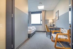 Rúm í herbergi á ABC Hotel by Reykjavik Keflavik Airport