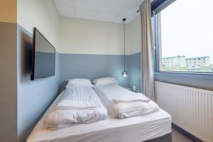 Rúm í herbergi á ABC Hotel by Reykjavik Keflavik Airport