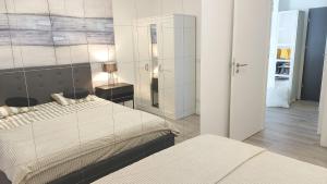 Posteľ alebo postele v izbe v ubytovaní Apartament Mare , Rewal ulica Szczecińska 21 Apartament nr 3