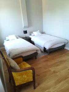 Postel nebo postele na pokoji v ubytování Maison Angulus Ridet