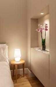 Łóżko lub łóżka w pokoju w obiekcie BSJ15-Borgo San Jacopo Room