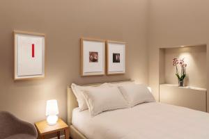 Łóżko lub łóżka w pokoju w obiekcie BSJ15-Borgo San Jacopo Room