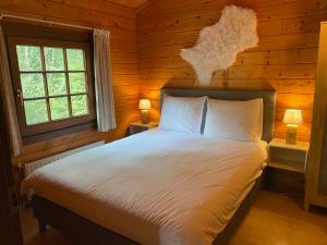 מיטה או מיטות בחדר ב-De Blokhut