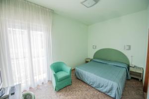 Postel nebo postele na pokoji v ubytování Alba Hotel