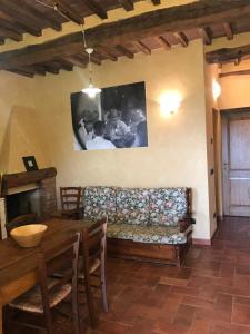 a living room with a couch and a table at Podere Marroneto in Lama