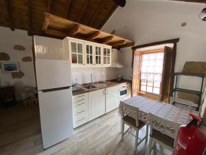 Kuchyň nebo kuchyňský kout v ubytování Casa La Tosca