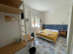 Postel nebo postele na pokoji v ubytování Acquadamare B&B
