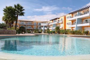 a large swimming pool in front of a building at Top Quality Apartment in Lagos