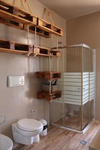 a bathroom with a toilet and a glass shower at KatlantiK Ca Madeira Deluxe in Sal Rei +124 photos