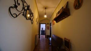 a hallway in a house with a chandelier at Casa Rural Plaza Vieja Saldaña in Saldaña