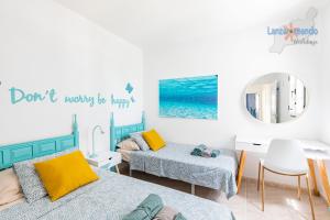 Łóżko lub łóżka w pokoju w obiekcie Vivienda Vacacional Timanfaya