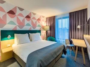 Posteľ alebo postele v izbe v ubytovaní Holiday Inn - Warsaw City Centre by IHG