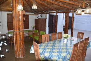 a dining room with a table and chairs at La Casa Maruja Habitación doble P in San Bartolo