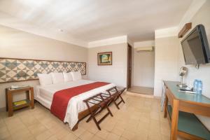 Postel nebo postele na pokoji v ubytování Hotel Caribe Merida Yucatan