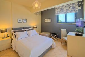 Posteľ alebo postele v izbe v ubytovaní Marini Luxury Apartments and Suites