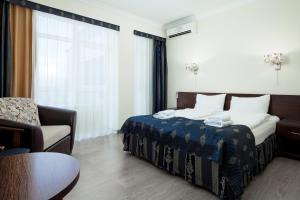 Кровать или кровати в номере Guest House Altai