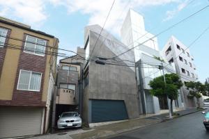 a building with a car parked in front of it at MONO - Vacation STAY 54271v in Tokyo