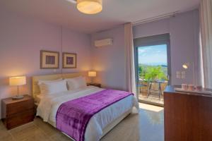Posteľ alebo postele v izbe v ubytovaní Marini Luxury Apartments and Suites