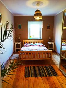 a bedroom with a bed and a window at Chopina 6 na zielonym wzgórzu in Jedlina-Zdrój