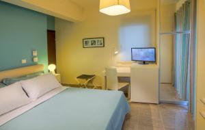 Posteľ alebo postele v izbe v ubytovaní Marini Luxury Apartments and Suites
